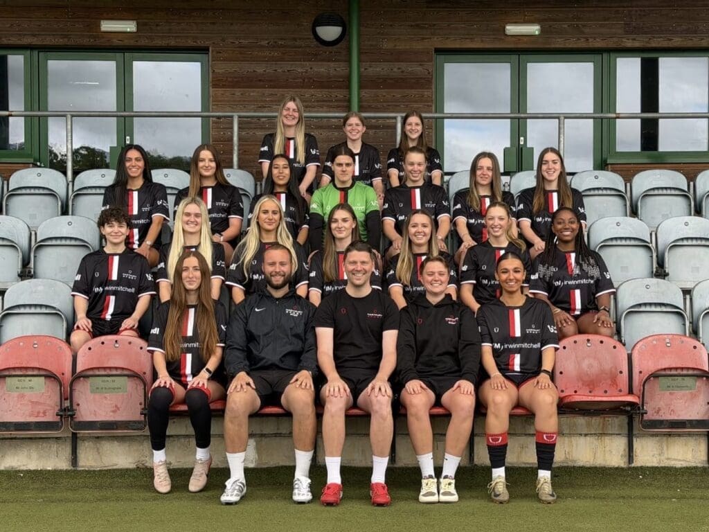 Kimana Joseph, sat first from the right of the middle row, poses with for the squad photo